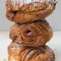 Chocopain Aux Amandes  · Filled with almond frangipane and chocolate, topped with confectioner’s sugar & almond slive...