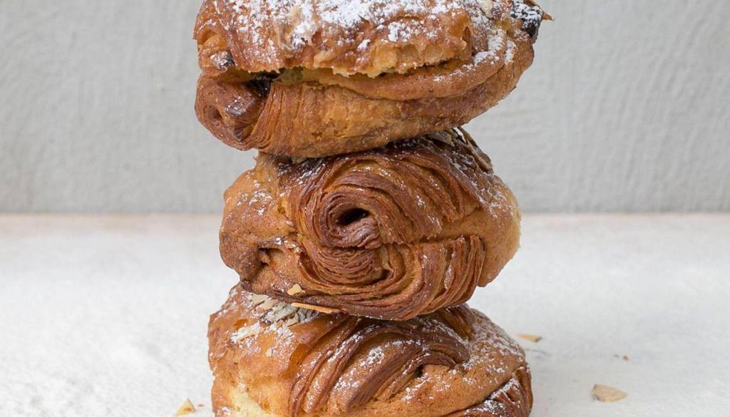 Chocopain Aux Amandes  · Filled with almond frangipane and chocolate, topped with confectioner’s sugar & almond slivers.