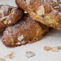Croissant Aux Amandes · Filled with almond frangipane topped with confectioner’s sugar & almond slivers.
​Best Crois...