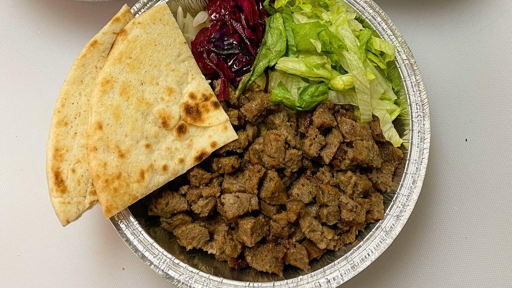Gyro Platter · Served over rice with lettuce, purple salad and pita.