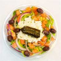 Greek Salad · Lettuce, tomato, onion, olives, feta cheese, stuffed grape leaves, extra virgin olive oil, a...