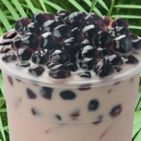 Coconut Milk Tea · Sweet and smooth coconut milk tea with topped chewy tapioca pearls.