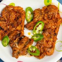 Lamb Chops · Two pieces. Juicy lamb chops marinated in yogurt and spices.