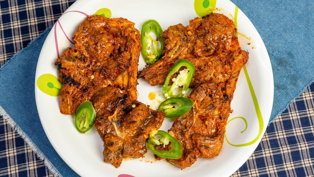Lamb Chops · Two pieces. Juicy lamb chops marinated in yogurt and spices.