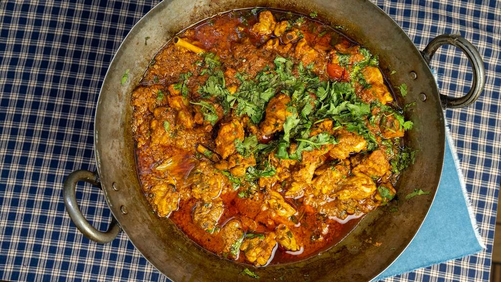 Karahi Chicken · Tender pieces of chicken, tomatoes, herbs and spices cooked in a special sauce.
