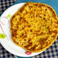 Qeema Paratha · Slightly spiced ground chicken cooked inside the bread.