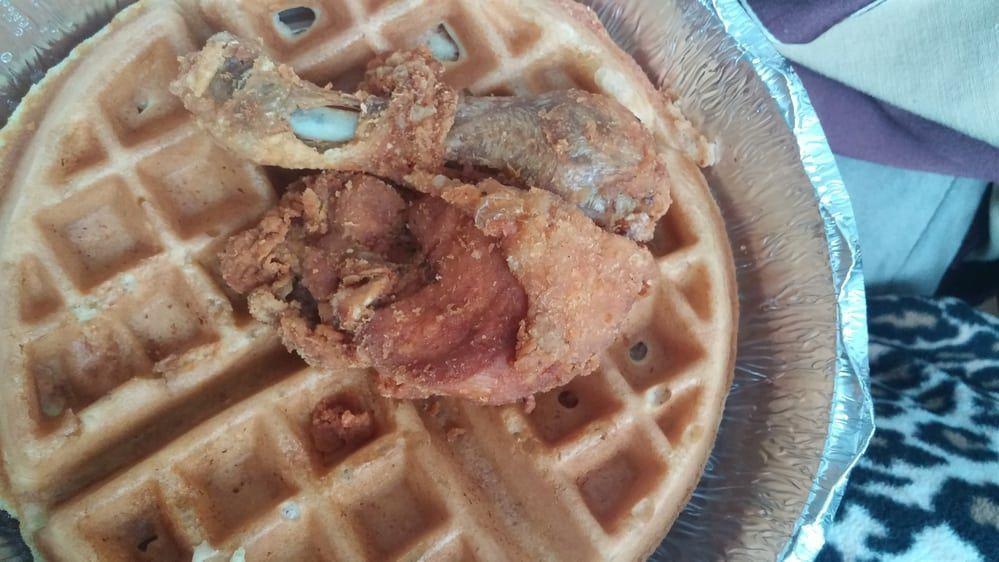 Chicken & Waffles · Waffles and two pieces of fried chicken. Served with butter and syrup.