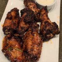 Chicken Wings · Choice of our many famous sauces. Served with blue cheese dip.