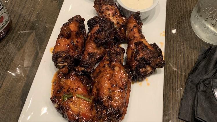 Chicken Wings · Choice of our many famous sauces. Served with blue cheese dip.