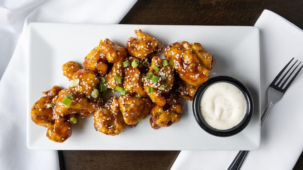 Kfc (Krispy Fried Cauliflower) · Coconut turmeric battered cauliflower with General Tso's sauce.