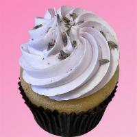 Lavender Lemon Cupcake · lemon cake, lemon curd filling, topped with lavender frosting and edible lavender flowers ||...