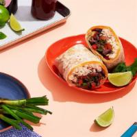 The Veggie Quesarito · Our delicious veggie Quesarito with fajita peppers and onions, rice, beans, cheese, and pico...
