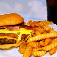Breakfast Burger. · Hash browns, an egg*, bacon and American cheese on a toasted bun. Served with crinkle-cut fr...