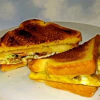 The Grandwich. · Scrambled eggs, sausage, bacon and American cheese on potato toasted bread. Served with hash...
