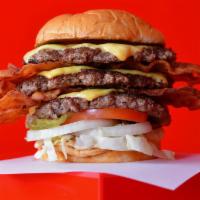 Shakin' Triple Bacon Cheeseburger · Three juicy grilled beef burger patties each smashed to perfection on a toasted potato bun w...