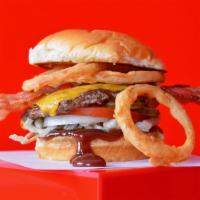 Shakin'  Bbq Bacon Smash Cheeseburger · Juicy, grilled beef burger smashed to perfection with American cheese, smoked bacon,
crispy ...