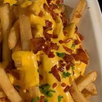 Cheese Fries · Crinkle cut fries topped with melted cheese sauce.