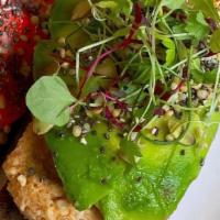 Spicy Cashew Tartine · seed bread, spicy cashew spread, avocado, superseed sprinkle, micro greens