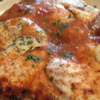 Veal Parmigiana · Served with cappellini pasta.