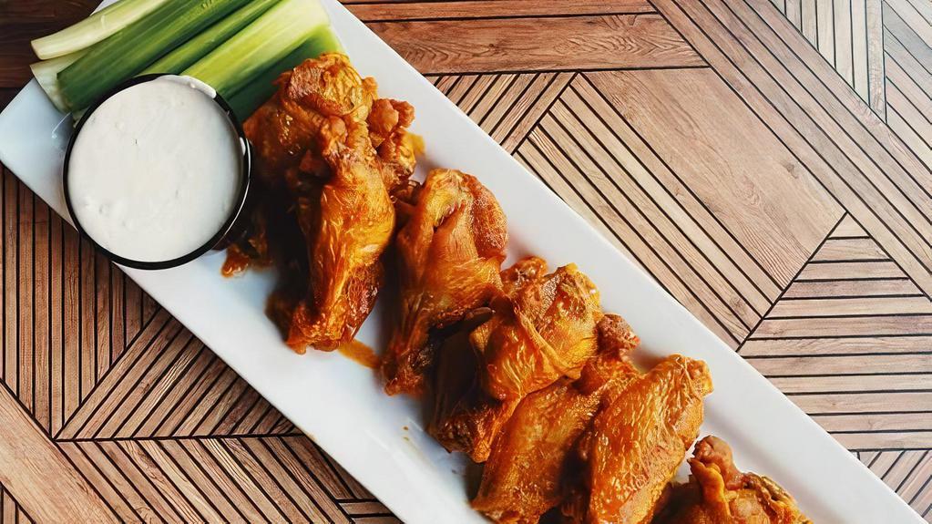 Buffalo Wings (25 Pieces) · Authentic buffalo flavor- fuzed, new york-style chicken wings hand-spun in choice of sauce. Served with blue cheese and celery.