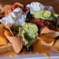 Nachos Muchachos · These classic tex-mex nachos are packed and loaded to the max! These nachos muchachos come w...