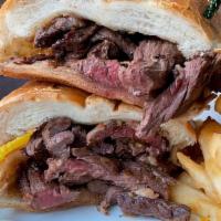 Sliced Angus Grand Skirt Steak Sandwich · Sliced angus grade skirt steak, grilled to your liking, white wine and garlic over a toasted...