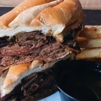 The American Dip Sandwich · A perfect union of tender and juicy thinly sliced Angus roast beef, caramelized onions, and ...