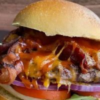 Texas Burger · Our Texas burger is served on a toasty bun and topped with cheddar, bacon, a southern style ...