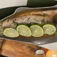 Bronzino · Steamed whole fish with cilantro, garlic, chili and lime broth