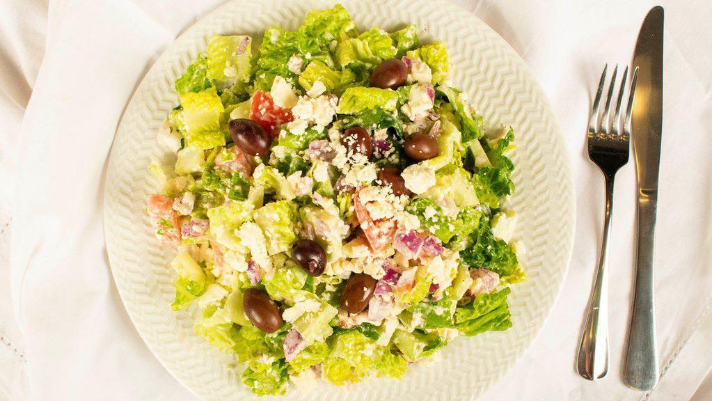 Greek Salad · Romaine, cucumber, tomato, feta, onion, olives and Greek dressing.