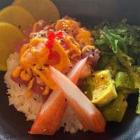 Poke Bowl · Salmon, tuna, cucumber, avocado, edamame and serve with our house sauce