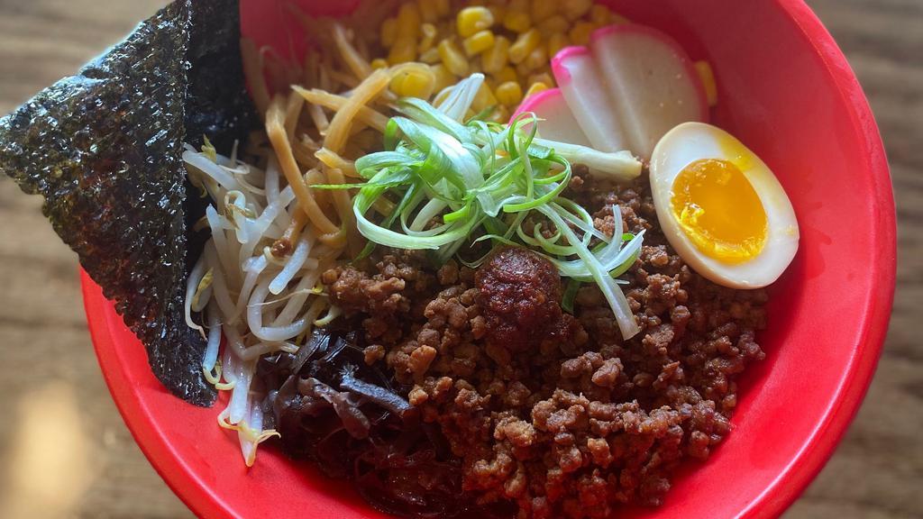 Tan Tan Ramen · Mild spicy miso and chicken broth soup with sesame paste, topped with minced pork, bean sprouts, chopped scallions and a seasoned boiled egg. Served with golden noodles.  Protein: Pork.
