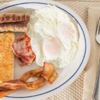 Two Eggs Breakfast · 2pcs bacon or 2 sausage, hash browns & toast.