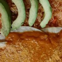 Huevos Rancheros Eggs Ranch Mexican Style · Two eggs, over médium on a warm tortilla with spicy red salsa, avocado, cheese rice, and bea...