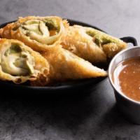 Avocado Spring Rolls · House made guacamole wrapped in an egg roll, served with a hoisin plum dipping sauce.