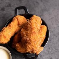 Coconut Chicken · Chicken strips coated with sweet coconut served with a piña colada sauce.