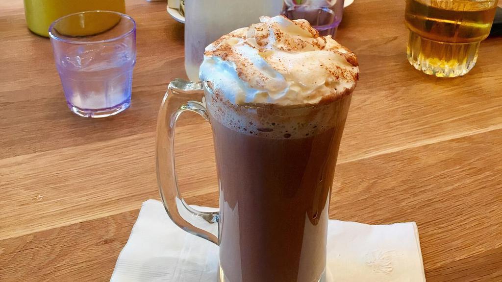 Hot Chocolate · Melted rich hot chocolate, topped with a touch of whipped cream.