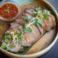 Kor Moo Yang · succulent grilled pork jowl with spicy tamarind jaew dipping sauce