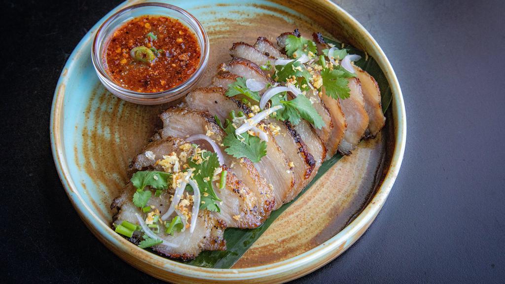 Kor Moo Yang · succulent grilled pork jowl with spicy tamarind jaew dipping sauce