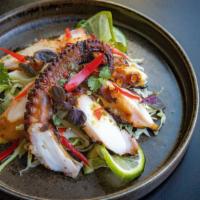 Pla Muk Yang  · Spicy, gluten free.   a favorite thai after-school treat, grilled octopus with chili lime sa...
