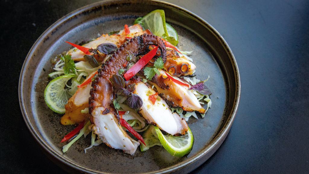 Pla Muk Yang  · Spicy, gluten free.   a favorite thai after-school treat, grilled octopus with chili lime sauce. (Spicy,Gluten free)