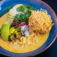 Khao Soi · Chicken with northern style curry, egg noodle, shallot, preserved mustard green, and cilantro.