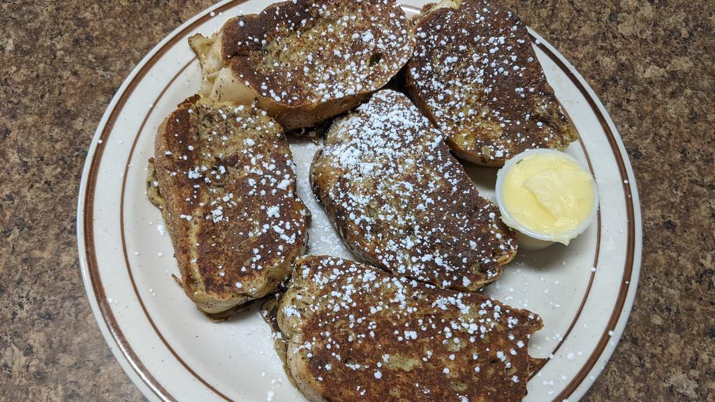 Authentic French Toast · Five slices of French bread, dipped in our special batter, grilled to a golden brown and topped with a sprinkling of sugar.