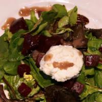 Warm Goat Cheese & Beet Salad (Gf) · On mesclun greens with candied pecans and raspberry vinaigrette. Gluten free available.