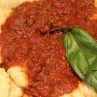 Gnocchi Bolognese · Potato pasta with fresh meat sauce.