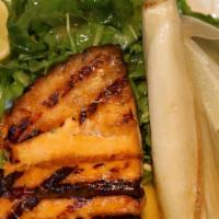 Grilled North Atlantic Salmon (Gf) · Served with caramelized endive and baby arugula in a light orange sauce. Gluten free availab...