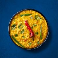  Divine Yellow Lentils  (Vegan) · Yellow lentils, slow-cooked to perfection and tempered with cumin, garlic, and chilies. Serv...