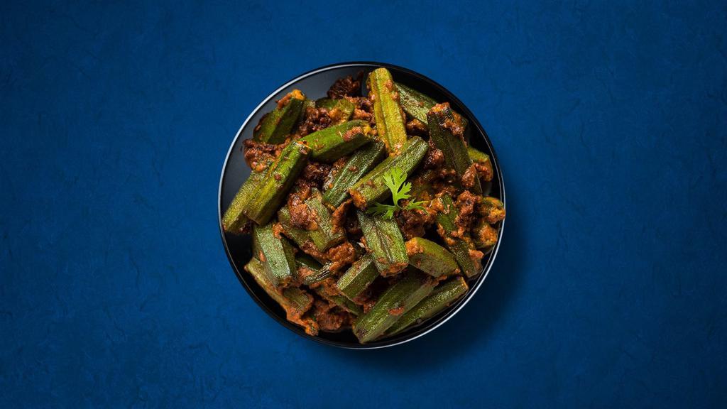 Okra Masala (Vegan) · Diced fresh okra, sauteed in a curry base made of onions, tomatoes, fresh herbs, and spices. Served with a side of aromatic white rice.
