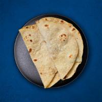 Chapati (Vegan) · Whole wheat flatbread baked to perfection over a pan.