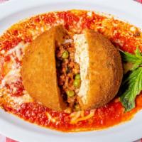 Sicilian Rice Ball Parm · One large Sicilian rice ball, ground meat, peas, mozzarella, and tomato sauce.